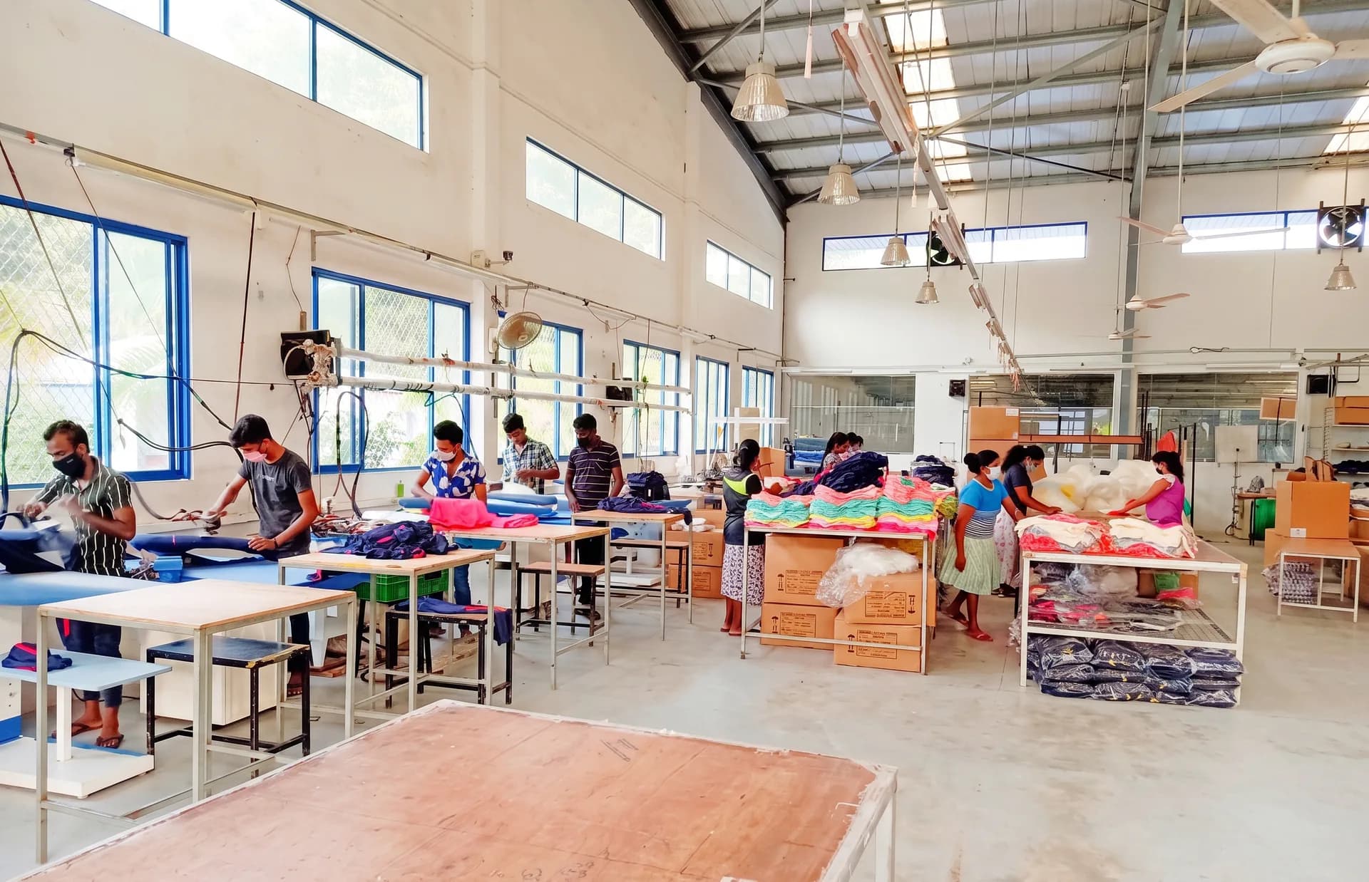Dewmini finishing team checking and packing garments